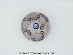 Clichy patterned millefiori glass paperweight with central red,