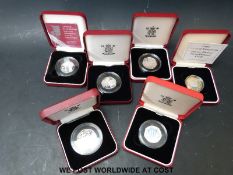 Six 50 pence silver proof cased coins,