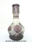 An overlaid cameo glass bottle vase with amethyst decoration of poppies over clear ground,
