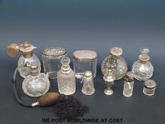 Nine Victorian and later hallmarked silver topped dressing table bottles and pots together with two