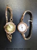 Two 9ct gold ladies wristwatches, one with Roman numerals on white enamel face,