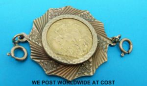 A 9ct gold mount set with a 1925 gold full sovereign (14.
