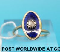 A Victorian ring set with blue guilloche enamel and a point cut diamond