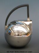 An Oliver Hemming polished stainless steel designer teapot,