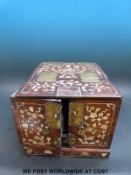 An eastern rosewood and mother of pearl inlaid dressing table box with fold out mirror to top