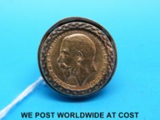 A 9ct gold ring set with a 1926 gold full sovereign (19.
