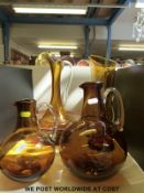 A Whitefriars amber glass jug and bowl together with four Whitefriars amber glass jugs