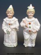 A pair of 19thC nodding clown figures
