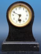 A Victorian mantel clock in balloon shaped case,