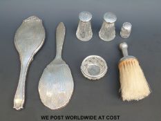 A hallmarked silver mounted wig brush,
