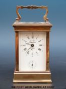 A French brass carriage clock with alarm, 'L'Epee Fondée en 1839, Saint Suzanne, France' to dial,