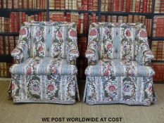 A pair of bespoke button back rolled back club chairs in Liberty style print