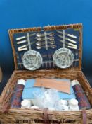 A vintage picnic hamper with original contents,
