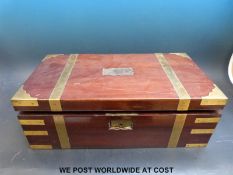A 19thC brass bound mahogany writing slope with secret drawers to top section and drawer below,