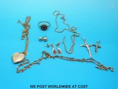 A collection of 9ct gold to include a ring set with garnets in a cluster, three chains,
