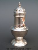 A Georgian hallmarked silver pepper, height 10.