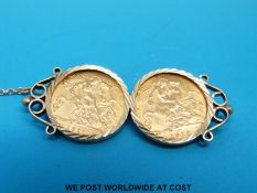 A 9ct gold bar brooch set with two gold half sovereigns, 1911 & 1914 (12.