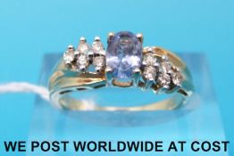 A yellow metal ring marked 14k set with topaz (size K)