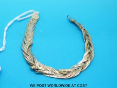 A tri-coloured 14ct gold bracelet (10.