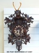 A c1930 Black Forest cuckoo clock with carved stag,