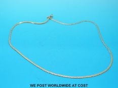 A yellow metal necklace, marked 9k (3.