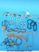 A collection of necklaces including three agate examples, tiger's eye, abalone, lapis lazuli,