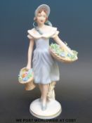 A Royal Dux figure of a maiden with flower baskets, impressed to base 1863123,