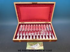 An inlaid mahogany cased twelve place setting fish service with servers