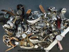 Over eighty various ladies and gentleman's wristwatches.
