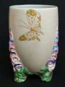 A Clarice Cliff 1930s vase with triple encrusted feet in the form of hollyhocks (16cm tall)