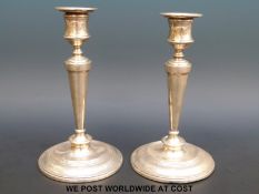 A pair of Edward VII hallmarked silver candlesticks,