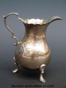 A Georgian hallmarked silver cream jug, London 1749 maker's mark but possibly JT,