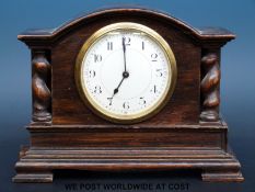 A Buren oak cased mantel clock with barley twist decoration,