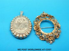 A 9ct gold locket with chased decoration and a 9ct gold brooch/pendant frame of foliate design (18.
