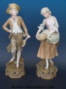 A pair of Austrian porcelain male and female figures