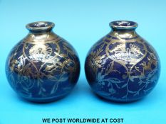 A pair of Richard Ginori vases in blue with silver lustre decoration (9cm tall)