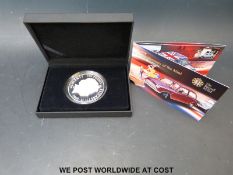 An Alderney 50th Anniversary of the Mini £10 silver proof coin (diameter 65mm, weight 155.