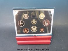 Three UK proof coin sets comprising two £5 examples 1999 and 1996,