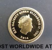 A Jubilee mint miniature gold one crown coin 2014