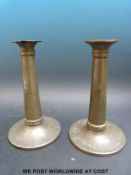 A pair of Tudric pewter Art Nouveau candlesticks with hammered finish (height 20.