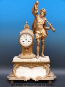 A figural ormolu/gilt metal and marble mantel clock featuring a hunter,