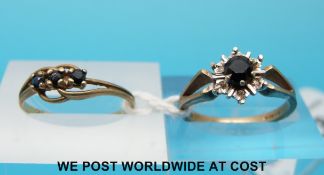 Two 9ct gold rings one set with three sapphires and the other a sapphire surrounded by diamonds in