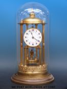 A late 19th / early 20thC anniversary clock with disc style pendulum,