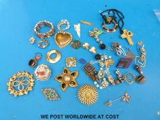 A collection of costume brooches to include Butler and Wilson etc.