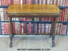 A 19thC inlaid walnut fold-over games table (width 91cm, depth 47cm,