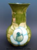 A large Moorcroft vase in stylised rose pattern by Sally Tuffin (10