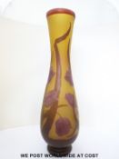 A Munza Galle style cameo glass vase with red tulips and foliage overlaid on a yellow ground,
