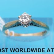 A 9ct gold ring set with a round cut diamond measuring approximately 0.