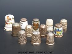 A collection of thimbles including six hallmarked silver examples
