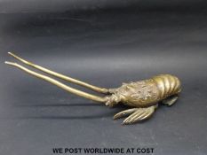 A bronze or similar model of a crayfish,
